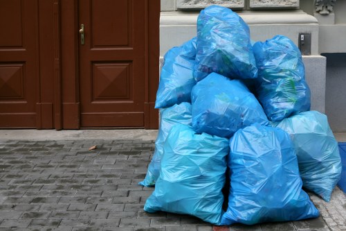 Homeowner loading waste into a skip container