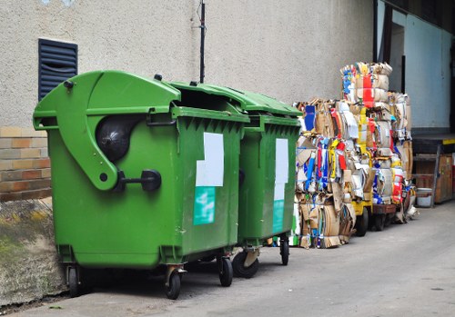 Mini skips being loaded with household waste